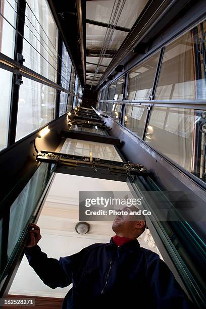repairman maintenance and repair of a lift - lift shaft stock pictures, royalty-free photos & images