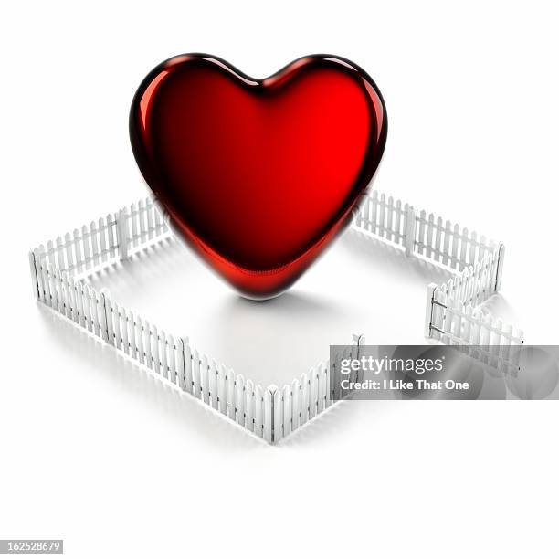 red heart shape surrounded by white picket fence - white picket gate stock pictures, royalty-free photos & images