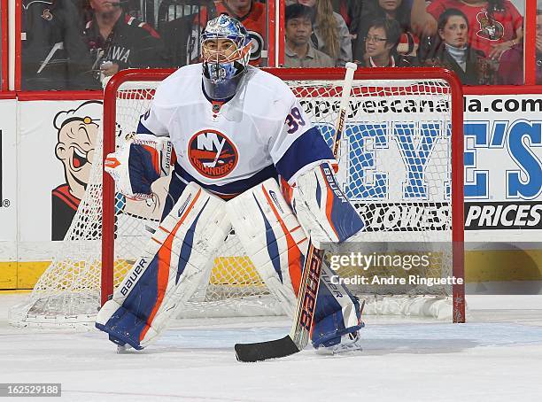 Rick DiPietro of the New York Islanders guards his net against the Ottawa Senators on February 19, 2013 at Scotiabank Place in Ottawa, Ontario,...