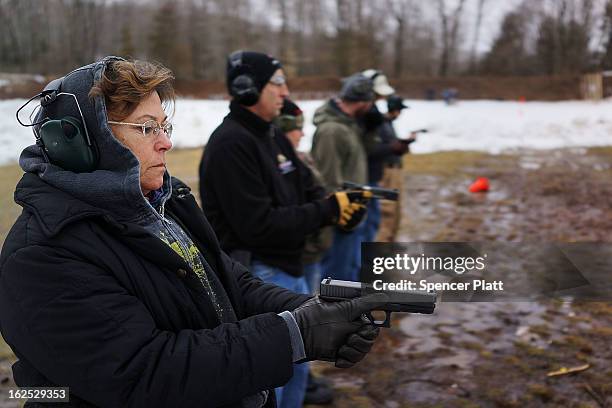 Students learn to fire their pistols at a class taught by King 33 Training at a shooting range on February 24, 2013 in Wallingford, Connecticut. King...