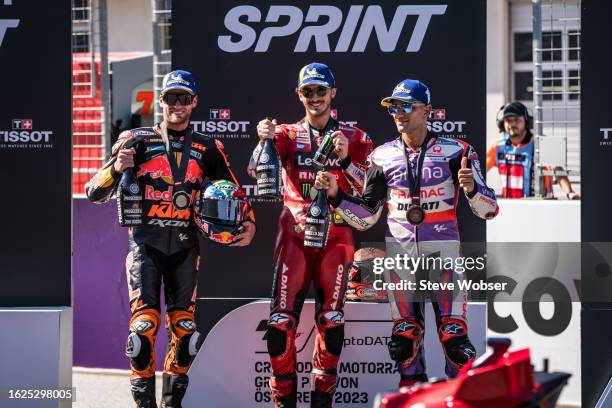 Brad Binder of South Africa and Red Bull KTM Factory Racing , Francesco Bagnaia of Italy and Ducati Lenovo Team and Jorge Martin of Spain and Prima...