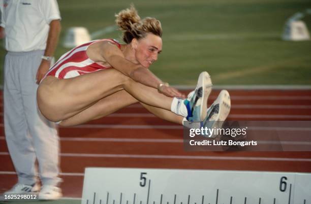 German athlete Heike Drechsler competes in the women's long jump event at the 1993 IAAF World Championships, held at the Neckarstadium in Stuttgart,...