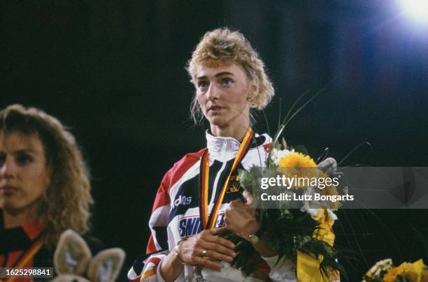 Danish athlete Renata Nielsen and German athlete Heike Drechsler on the winners' podium after the women's long jump event at the 1993 IAAF World...