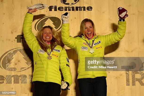 Jessica Diggins and Kikkan Randall of the United States celebrate with their Gold medals on the podium at the medal ceremony for the Women's Team...
