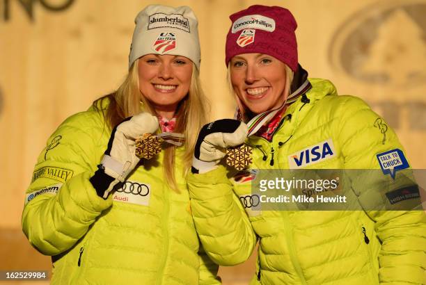 Jessica Diggins and Kikkan Randall of the United States celebrate with their Gold medals on the podium at the medal ceremony for the Women's Team...