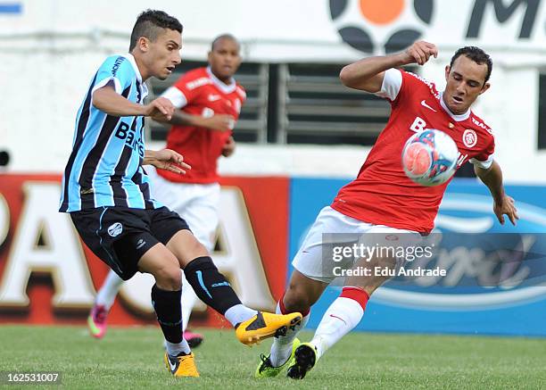 Josimar, of Internacional struggles for the ball with Bressan of Gremio during a match between Gremio and Internacional as part of the Gaucho...