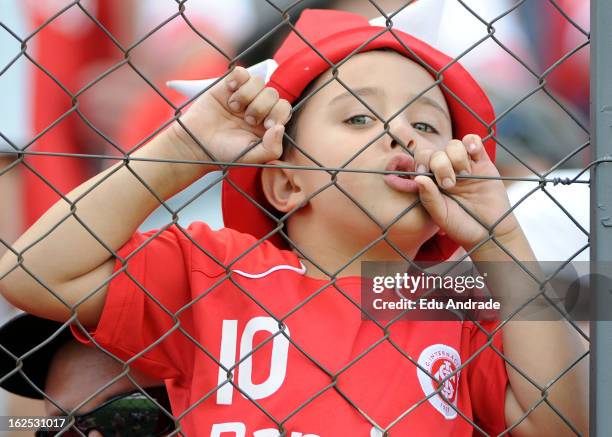 Supporters of Internacional cheer their team during a match between Gremio and Internacional as part of the Gaucho championship at Centenario stadium...