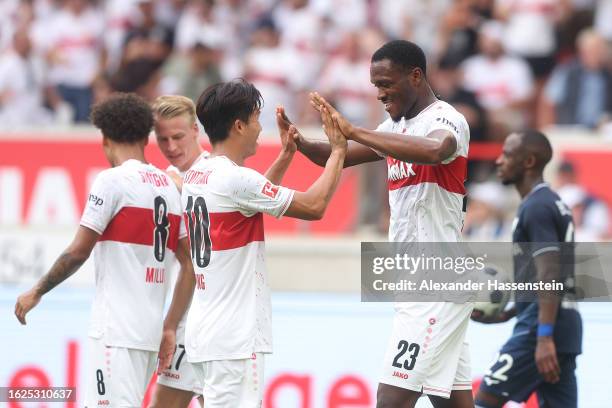 Dan-Axel Zagadou of VfB Stuttgart celebrates with teammate Jeong Woo-Yeong after scoring the team's second goal during the Bundesliga match between...