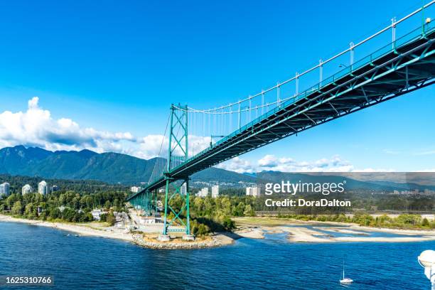 the view of west vancouver and lions gate bridge, vancouver, canada - vancouver lions gate stock pictures, royalty-free photos & images