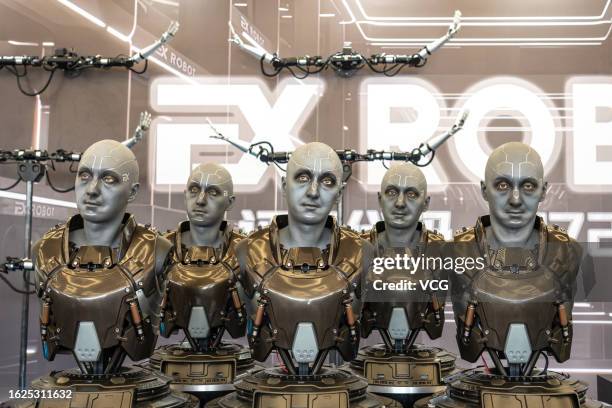 Humanoid robots are on display at the booth of EX Robots during 2023 World Robot Conference at Beijing Etrong International Exhibition & Convention...