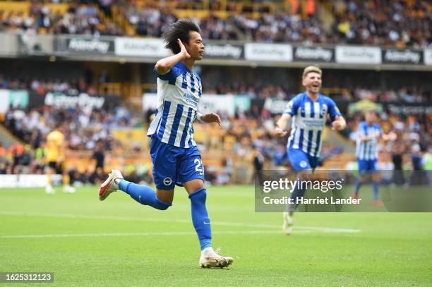 Kaoru Mitoma of Brighton & Hove Albion celebrates after scoring the team's first goal during the Premier League match between Wolverhampton Wanderers...