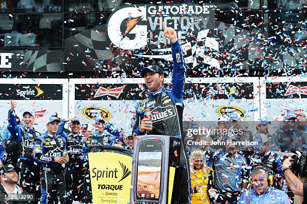 Jimmie Johnson, driver of the Lowe's Chevrolet, celebrates in victory lane after winning the NASCAR Sprint Cup Series Daytona 500 at Daytona...