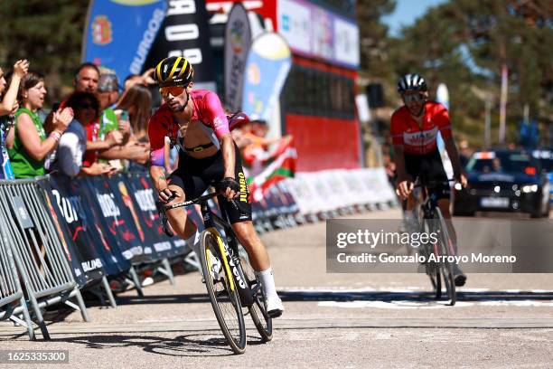 Primoz Roglic of Slovenia and Team Jumbo-Visma - Purple Leader Jersey crosses the finish line as stage winner ahead of Adam Yates of Great Britain...