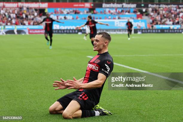 Florian Wirtz of Bayer Leverkusen celebrates after scoring the team's third goal during the Bundesliga match between Bayer 04 Leverkusen and RB...
