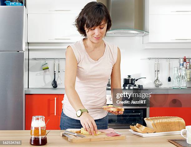 housewife making sandwiches in the kitchen - making sandwich stock pictures, royalty-free photos & images