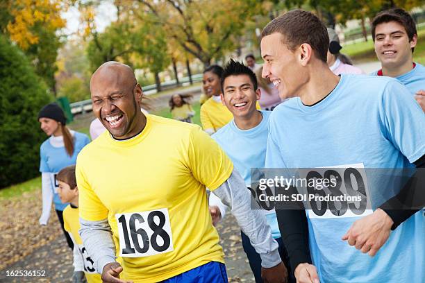 men at a charity race laughing together - charity gala 2012 stock pictures, royalty-free photos & images