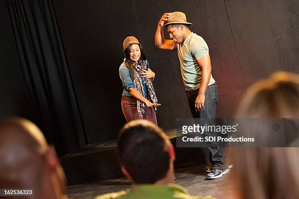 actors on stage performing in front of audience - actor stock pictures, royalty-free photos & images