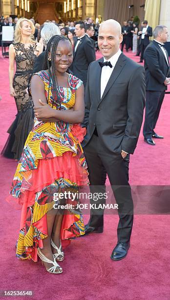 Rachel Mwanza , star of the Best Foreign Language Film nominee War Witch, and director Kim Nguyen arrive on the red carpet for the 85th Annual...