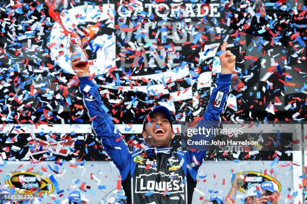 Jimmie Johnson, driver of the Lowe's Chevrolet, celebrates in victory lane after winning the NASCAR Sprint Cup Series Daytona 500 at Daytona...