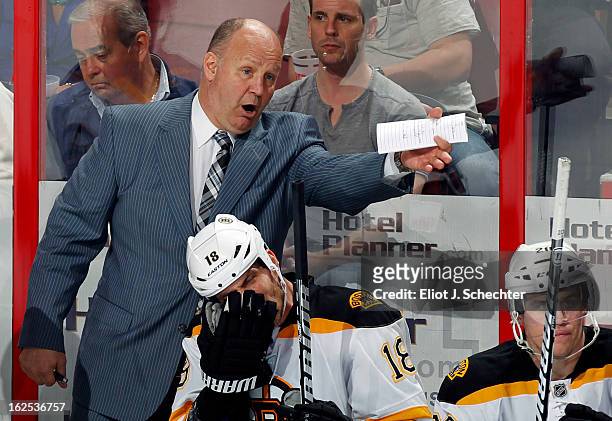 Head Coach Claude Julien of the Boston Bruins directs his team from the bench against the Florida Panthers at the BB&T Center on February 24, 2013 in...