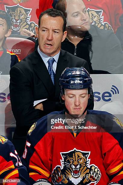 Head Coach Kevin Dineen of the Florida Panthers watches the action against the Boston Bruins at the BB&T Center on February 24, 2013 in Sunrise,...