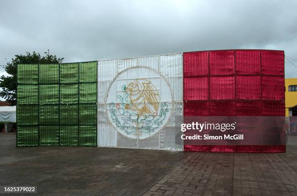 mexican flag decoration, plaza de la constitución, chignahuapan, puebla, mexico - chignahuapan stock pictures, royalty-free photos & images