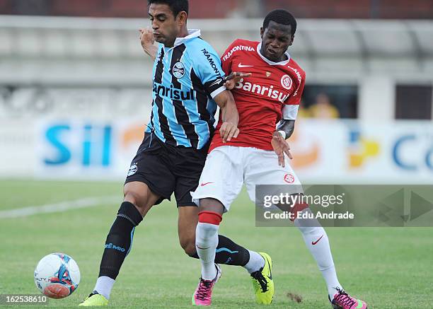 Werley of Gremio fights for the ball with Fred of Internacional during a match between Gremio and Internacional as part of the Gaucho championship at...