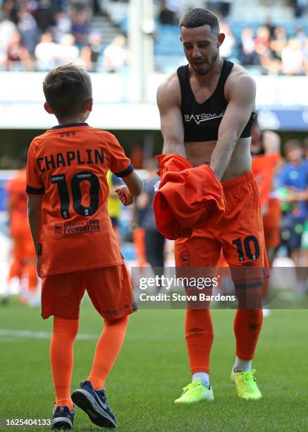 Conor Chaplin of Ipswich Town gives his shirt to the Ipswich Town mascot after the Sky Bet Championship match between Queens Park Rangers and Ipswich...