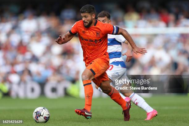 Sam Morsy of Ipswich Town runs with the ball under pressure from Ilias Chair of Queens Park Rangers during the Sky Bet Championship match between...