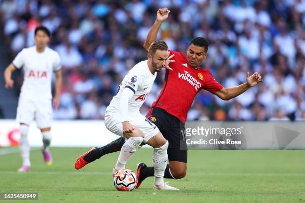 James Maddison of Tottenham Hotspur is challenged by Casemiro of Manchester United during the Premier League match between Tottenham Hotspur and...