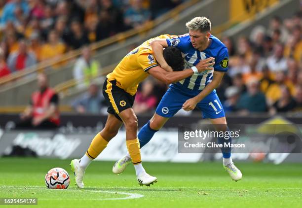 Billy Gilmour of Brighton & Hove Albion battles with Matheus Nunes of Wolverhampton Wanderers during the Premier League match between Wolverhampton...