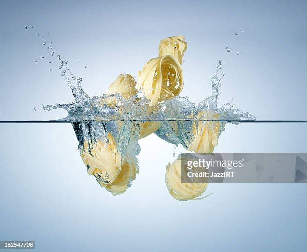 splash pasta - boiling pasta stock pictures, royalty-free photos & images