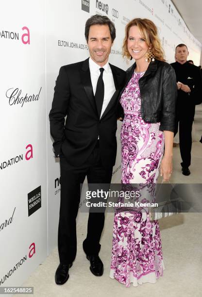 Actor Eric McCormack and Janet Holden attend Chopard at 21st Annual Elton John AIDS Foundation Academy Awards Viewing Party at West Hollywood Park on...