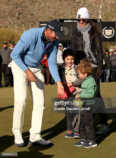 Matt Kuchar celebrates with his sons Carson and Cameron and his wife Sybi after Kuchar won his championship match against Hunter Mahan 2 and 1 in 17...
