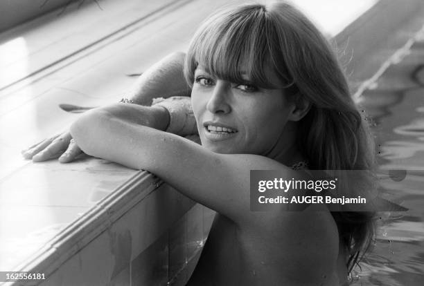 Nathalie Delon. Nathalie DELON avec son chien Masaï, un berger allemand; se baigne nue dans une piscine, fait du jogging sur la plage; écrit un...