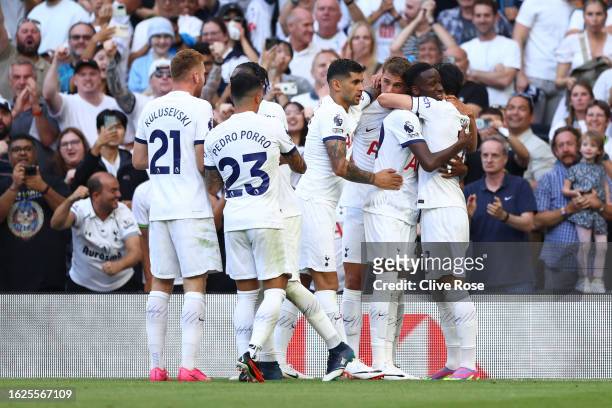 Pape Matar Sarr of Tottenham Hotspur celebrates with teammates after scoring the team's first goal during the Premier League match between Tottenham...