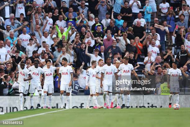 Pape Matar Sarr of Tottenham Hotspur celebrates with teammates after scoring the team's first goal during the Premier League match between Tottenham...