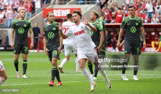 Luca Waldschmidt of Cologne celebrates after scoring during the Bundesliga match between 1. FC Koeln and VfL Wolfsburg at RheinEnergieStadion on...