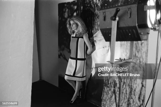 French actress Catherine Deneuve wears fashions by Yves Saint Laurent at a photo-shoot by German photographer Helmut Newton, 16th November 1981....