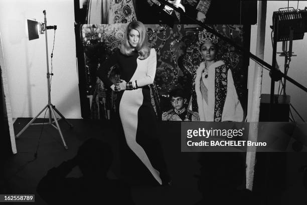 French actress Catherine Deneuve wearing fashions by Yves Saint Laurent at a photo-shoot by German photographer Helmut Newton, 16th November 1981....