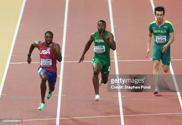 Noah Lyles of Team United States, Usheoritse Itsekiri of Team Nigeria and Jake Doran of Team Australia compete in heat 2 of the Men's 100m during day...