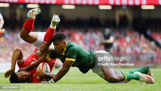 Rio Dyer of Wales is tackled by Canan Moodie of South Africa during the Summer International match between Wales and South Africa at Principality...
