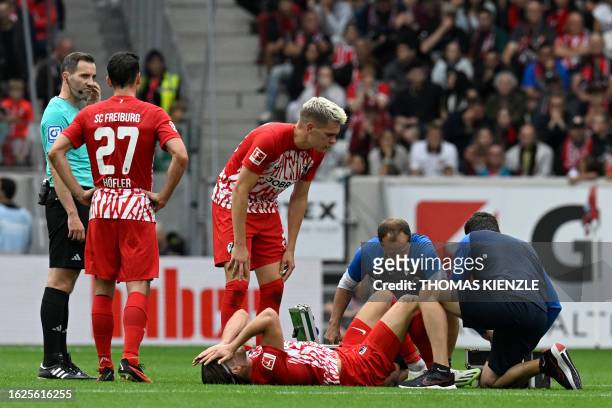 Freiburg's German forward Lucas Hoeler receives medical aid after an injury during the German first division Bundesliga football match between SC...