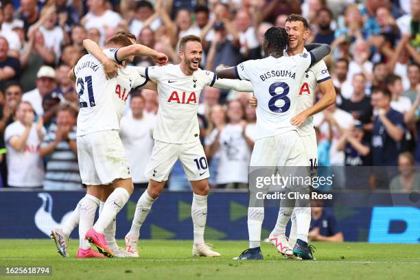 James Maddison of Tottenham Hotspur celebrates with teammates after teammate Ben Davies scores the team's second goal during the Premier League match...