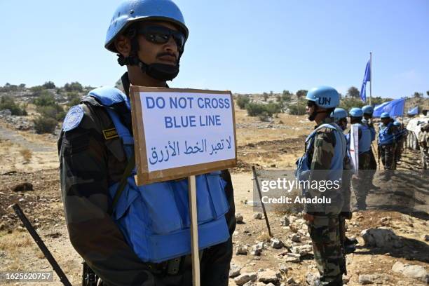 The United Nations Interim Peace Forces stand guard by the border at the Kafr Shuba region, considered a disputed area between Lebanon and Israel, to...