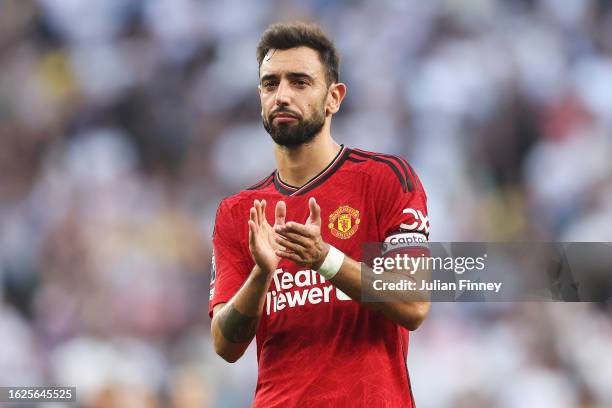 Bruno Fernandes of Manchester United applauds the fans following the team's defeat during the Premier League match between Tottenham Hotspur and...