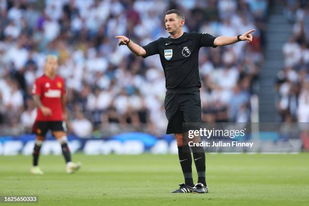 Referee, Michael Oliver gives the team instructions during the Premier League match between Tottenham Hotspur and Manchester United at Tottenham...