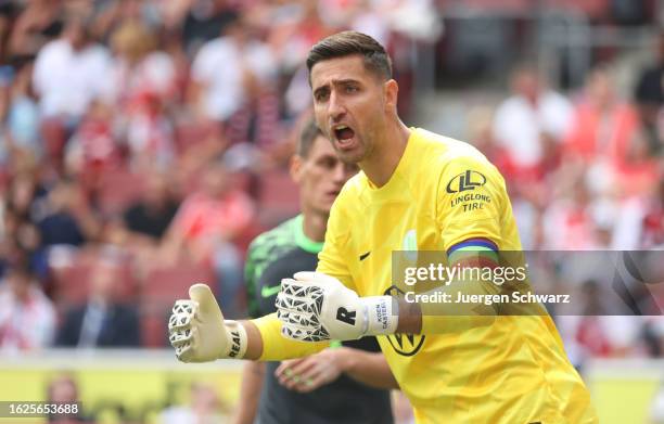 Koen Casteels of Wolfsburg gestures during the Bundesliga match between 1. FC Koeln and VfL Wolfsburg at RheinEnergieStadion on August 26, 2023 in...