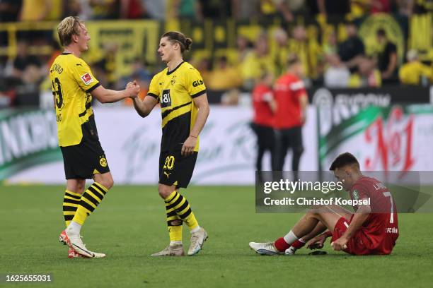 Julian Brandt and Marcel Sabitzer of Dortmund celebrate after winning 1-0 the Bundesliga match between Borussia Dortmund and 1. FC Köln at Signal...