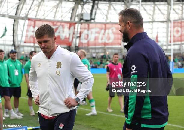 Owen Farrell the non playing England captain, looks on with his father Andy Farrell, who is the Ireland head coach after the Summer International...